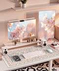 Pink Floral Desk Pad For Aesthetic Office Setup, XXL Large Mouse Pad with Non Slip Base and Stitched Edges on desk.