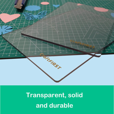 Clear 6 X 9 Die Cutting Plate for Machines, Durable Polycarbonate See Through Protector on green crafting mat with cutouts.