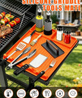 Orange rollable silicone grill mat for griddle tools and BBQ accessories with utensils on non-slip side shelf organizer