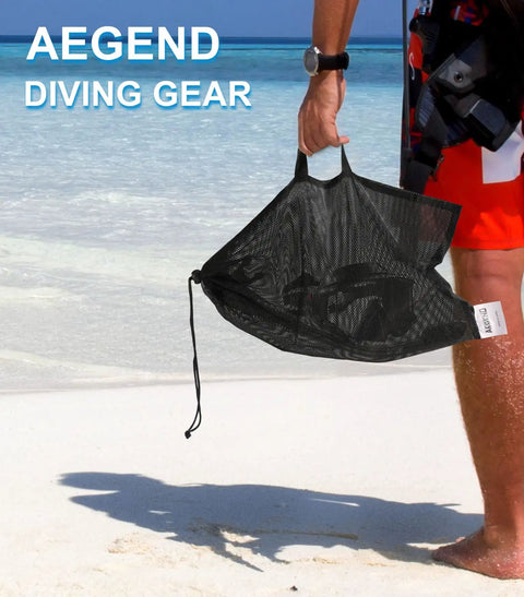 Person holding mesh carry bag on beach for 2 Pack Dry Snorkel Set For Adults With Panoramic View Dope Anti Leak And Anti Fog Tech
