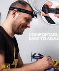 Rechargeable 1000 Lumen LED Headlamp With USB Power, IPX4 Waterproof Head Light worn by man, showing easy adjustment