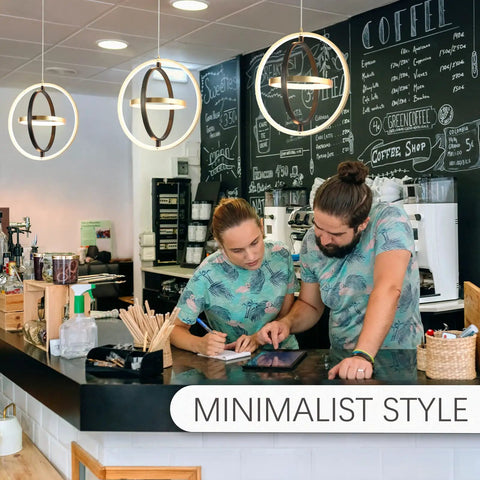 LED Pendant Light Fixture With Black And Gold Rings in modern cafe setting over counter scene