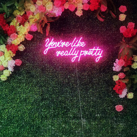 Massive 28 Inch Pink Neon Sign You're Like Really Pretty LED Light for Bedroom Bar Club Wall Decor against floral backdrop