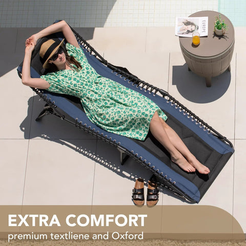 Woman relaxing on 4 Fold Padded Portable Outdoor Chaise Lounge Chair With Pillow And Side Pocket in blue on patio