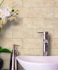 Peel And Stick Stone Tile Backsplash Kit, Roman Travertine, behind sink and orchids, no grout, real stone look.
