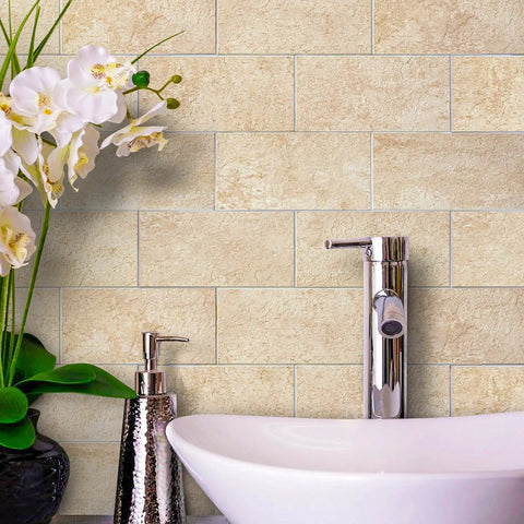Peel And Stick Stone Tile Backsplash Kit, Roman Travertine, behind sink and orchids, no grout, real stone look.