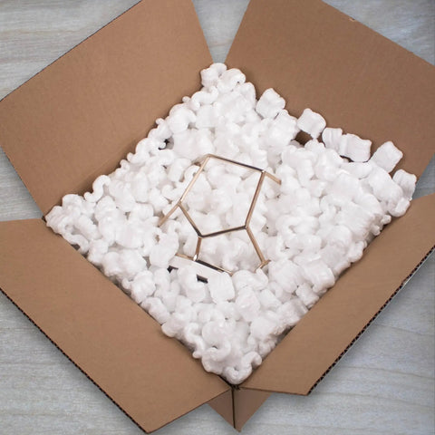 Heavy Duty White Packing Peanuts For Zero Stress Shipping Anti Static S Curve Half Cubic Foot Void Fill in a cardboard box.