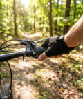 Cyclist using 7 Speed Twist Shifter Lever For MTB And Folding Bikes With Ergonomic Grip And Crisp Shifts on forest trail.
