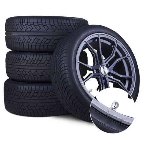 Close-up of TR-416-S metal valve stem, 1-inch outer mount, on alloy wheel with four tires in background.