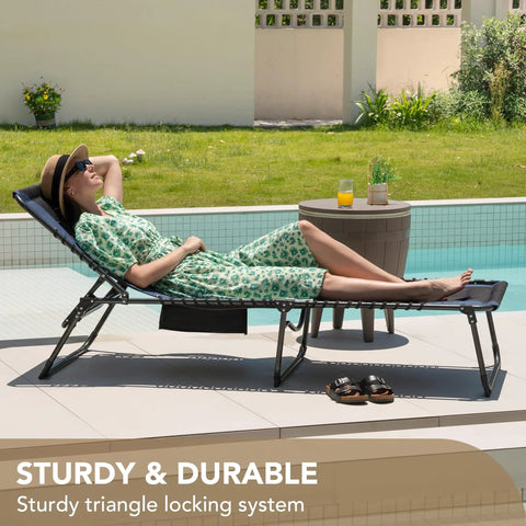 Woman relaxing on 4 Fold Padded Portable Outdoor Chaise Lounge Chair With Pillow And Side Pocket for patio sunbathing