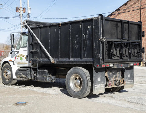 Beefy Steel Dump Truck Inspection Door With 12.38 x 13.5 Inch Opening, Detent Holder, Reversible Handle, Zinc Coated Paintable Finish For Medium And Heavy Duty Dump Trucks Built To Last, rear view on black dump body