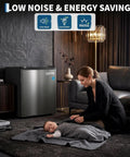 Compact Upright Freezer 1.1 Cubic Foot Stainless Steel Mini Cooler in living room with mother and baby, low noise design.