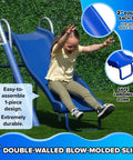 Child sliding down 5ft wave slide of Backyard Metal Swing Set With 5 Foot Wave Slide Two Swings Two Person Glider And Two Person Saucer Swing Standing Swing Outdoor Playset With Anchors For Up To Eight Kids 6 Year Warranty And Sturdy 6.1 Foot Tall.