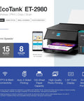 ET-2980 EcoTank Wireless All-In-One Color Supertank Printer on display with sample prints, ink tanks, and control panel screen visible.