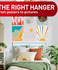 Room with colorful artwork above bed using Poster Strips 64 Count Damage Free Hanging Adhesive No Tools Hangs Up To 32 Posters Or Signs