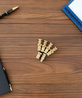 Metal Table Pins And Dowels Set For Furniture Joints And Desk Assembly on wooden surface with notebook and pen