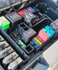 Plug And Play Manual Reset Fuse Block Kit With 3A 5A 7A 10A 15A 20A 25A 30A Blade Fuses In A 32V DC Assortment For Boats, Trucks, SUVs And Motorcycles With Marine Grade Protection And Quick Reset installed in an automotive fuse box