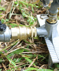 Three Quarter Inch Full Flow Brass Garden Hose Quick Connect Fittings Set No Fuss With Lead Free Full Port Design And High Volume Quick Release Coupler For Five Eighth And Three Quarter Inch Hoses installed on a metal sprinkler.