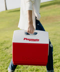 Person carrying Playmate Elite Red Cooler With One Hand Opening Button Spill Proof Locking Lid Built In Carry Handle for outdoor use