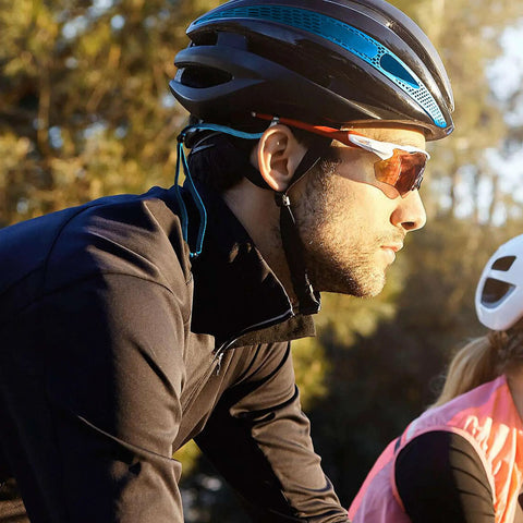 Cyclist wearing sunglasses and helmet with Glasses Strap For Men And Women Non Slip Clip Eyeglass Holder Around Neck Retainer Cord Lanyard Sports Sunglasses Strap With Universal Fit For Wide And Narrow Temples.