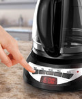 Super Convenient Programmable 12 Cup Coffee Maker With Removable Glass Carafe showing digital timer in a kitchen setting