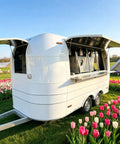 13 Foot White Mobile Catering Trailer Turnkey Commercial Food Truck With Fully Equipped Kitchen Setup Dot Approved near colorful tulips.