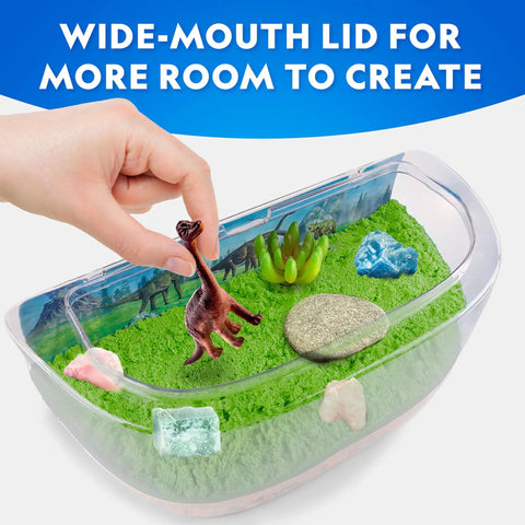 Light Up Dinosaur Terrarium Science Kit For Kids With Never Dry Sand Dino Figures A Backdrop And Gems Create A Colorful Prehistoric World You Can See Through A Wide Mouth Panorama View, wide-mouth lid with hand placing dino figure