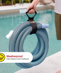 Person holding Heavy-Duty 28 Inch Storage Straps Set 2-Pack No-Fuss Hook And Loop Cord Carrier with hose by a pool.