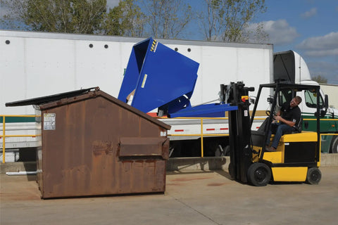 Solid Workhorse Steel Self Dumping Hopper For Forklift 3 Cubic Yard 2000 Lb Payload Capacity in use at a loading dock.