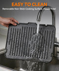 Removable nonstick cooking surface for Bakers Friend 6-in-1 Indoor Grill and Electric Griddle Combo being rinsed under a faucet.