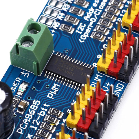 Close-up of 16 Channel PWM Servo Driver Module With I2C Control, showing PCA9685 IC and pins, compatible with Arduino Raspberry Pi.