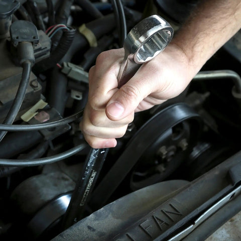 Person using 35mm Jumbo Combination Wrench Chrome Plated With Raised Panel Design on engine for high torque nuts and bolts