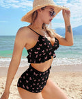 Model wearing two piece push up bathing suit for women with adjustable straps pink and black bow back cutout swimsuit removable padding on beach