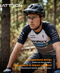 Man wearing Safety Glasses 6 Pack With UV400 Protection And ANSI Z87.1 Certification, in forest, cycling gear with helmet.