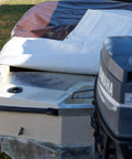 Boat covered by Tough As Nails Waterproof Reversible Tarp 12 By 24 Feet Thick 14 Mil Industrial Grade Tarp With Double Reinforced Corners