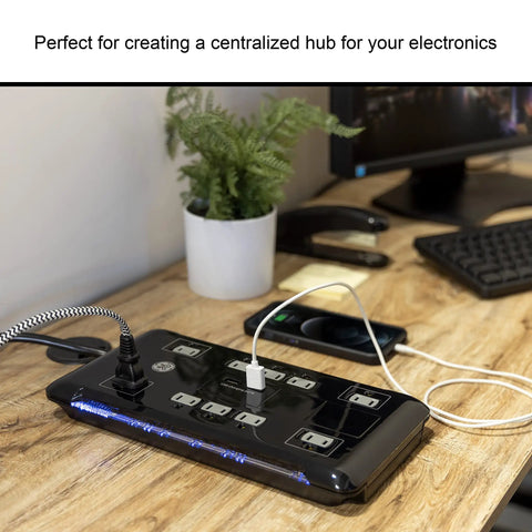 UltraPro 10 Outlet Surge Protector With USB Charging And Two USB Ports 2880 Joules 4 Foot Cord Black on desk with plugs