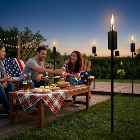Outdoor gathering with 55 Inch Outdoor Oil Torch Lamps Four Pack Rustproof Stainless Steel Citronella Torches in backyard setting