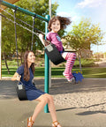 Two Pack Swing Seats With Metal Triangle Ring 30.4 By 5.9 Inch Supports 300 Lb Heavy Duty Replacement For Outdoor Playground Trees Backyard Kids And Adults Black in use by woman and child