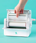 Big League Permanent Adhesive Refill Cartridge For 5 X 18 Foot Creative Station being installed in a crafting machine.