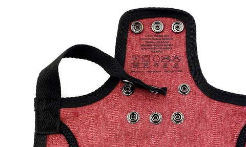 Close-up of burgundy canvas poultry saddle with adjustable straps and metal snaps, part of 4 Pack Medium-Large Poultry Saddles With Adjustable Straps.