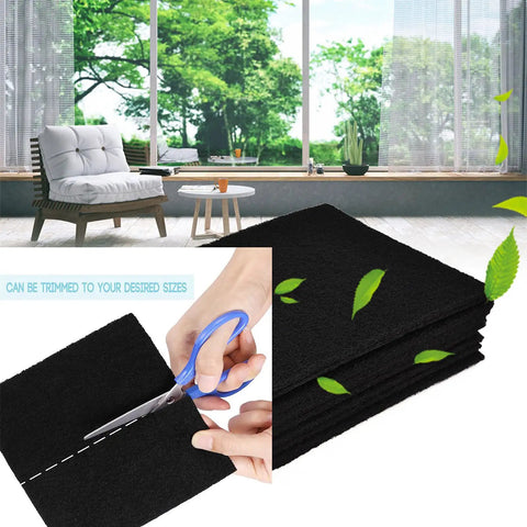 Person cutting Extra Thick 3/8 Inch 16x50 Activated Carbon Filter Sheet With MERV 7 for odor control in a home setting.