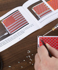 User assembling the American Flag DIY Soldering Project Kit With Compact Acrylic Shell For Hands On Electronics Learning on desk