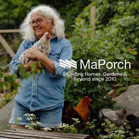Woman in denim shirt holding chicken, standing in garden with Chicken Wire Mesh Hardware Cloth 16 Inch By 15 Foot 18 Gauge Beefy Galvanized Steel Fence Mesh in background