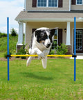Dog leaping over Adjustable Dog Agility Jump Hurdle for Backyard Obstacle Course Portable Training Bar in front of house