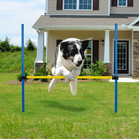 Dog leaping over Adjustable Dog Agility Jump Hurdle for Backyard Obstacle Course Portable Training Bar in front of house
