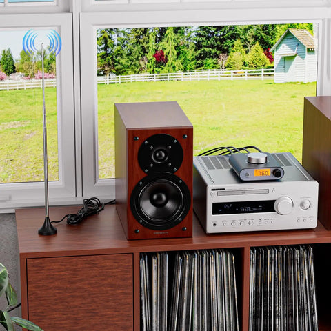 S5000 FM Radio Receiver With Si4730 Chip, Bluetooth And AUX In on a shelf next to a speaker and vinyl records, antenna by window.
