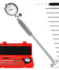 Dial bore gauge set with dial indicator and gray handle, includes multiple extension rods and a red carrying case.