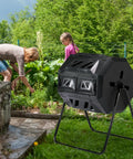 Heavy Duty 42 Gallon Dual Chamber Outdoor Compost Tumbler with sliding doors and rotating dual batch system in garden setting.