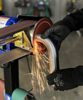 Real Badass 1HP Belt Grinder With Quick Swap 4By48 Inch Belt Auto Tension Rig And 4970 Sfpm Power cutting metal pipe with sparks flying.