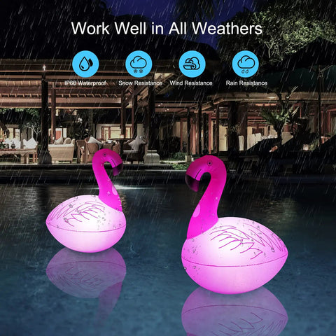 Solar Flamingo Floating Pool Lights 4 Pack illuminating at night in a rainy setting, showcasing IP68 waterproof capability.